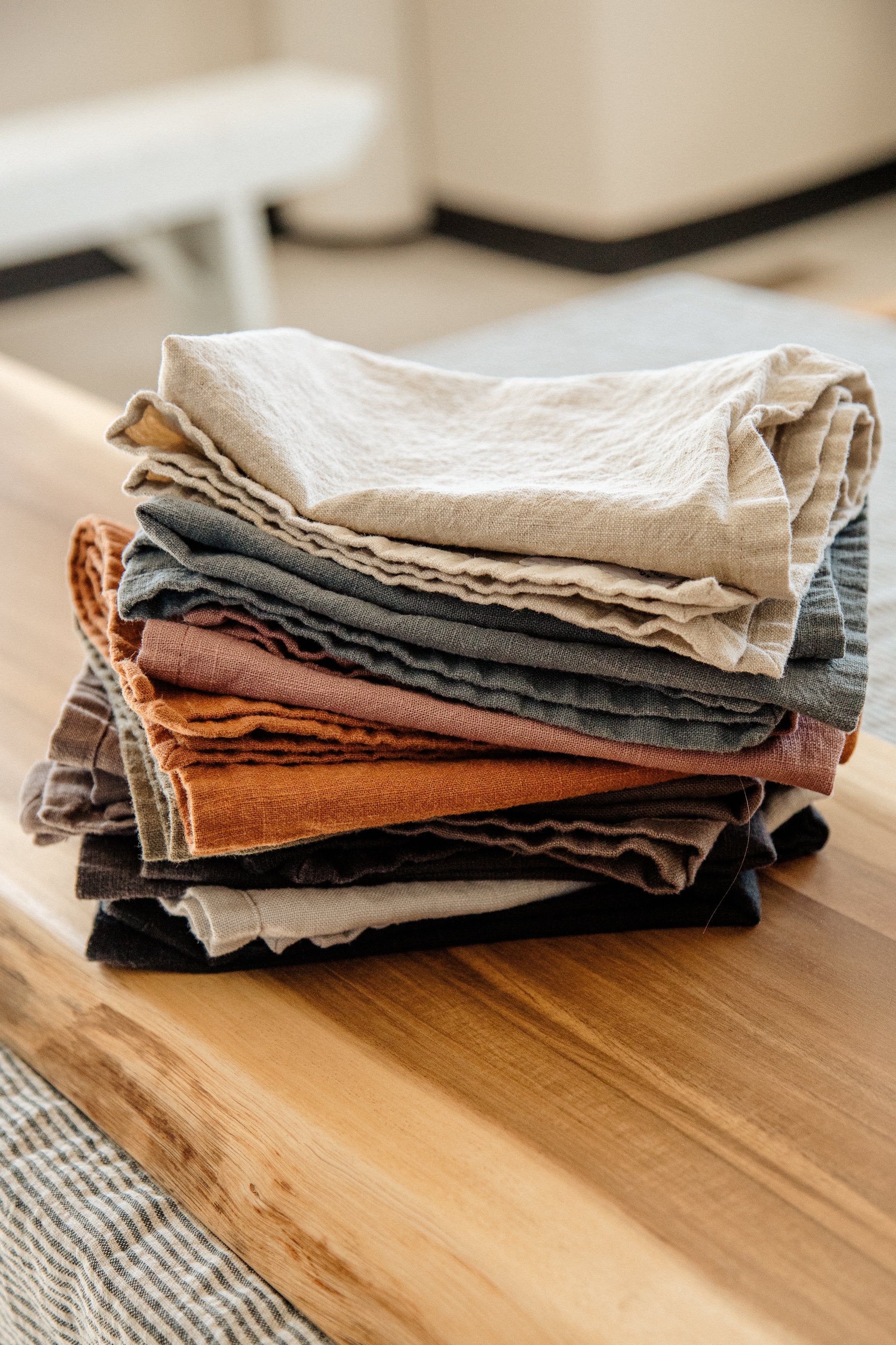 Stack of folded linen tea towels and napkins